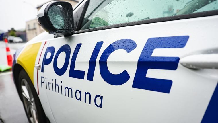 Man found hiding under car after vehicle crashes through Auckland fence