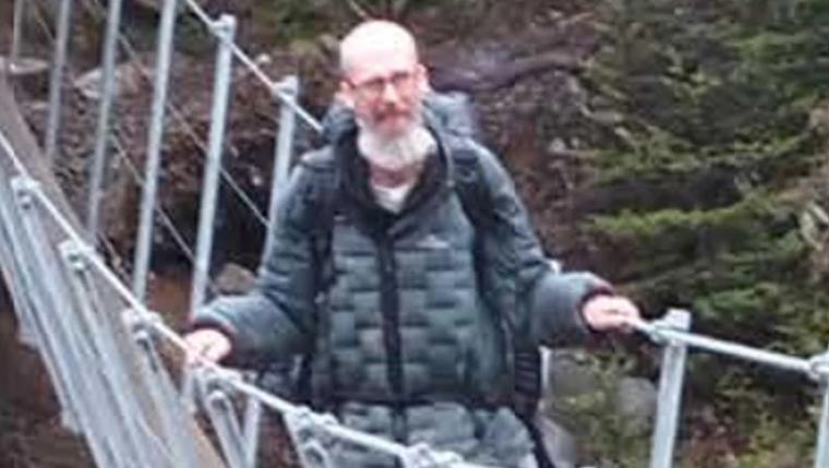 Weather forces pause in search for hiker swept down Canterbury river
