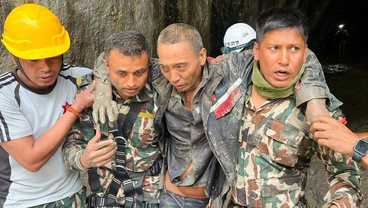 Rescuers in Nepal pull people alive from mud 10 days after devastating floods