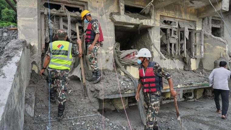 Symbolic funerals held in Nepal for those feared lost as some missing tourists make contact