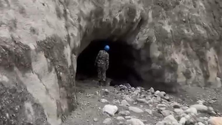 Rescuers race to save workers trapped in flooded tunnels